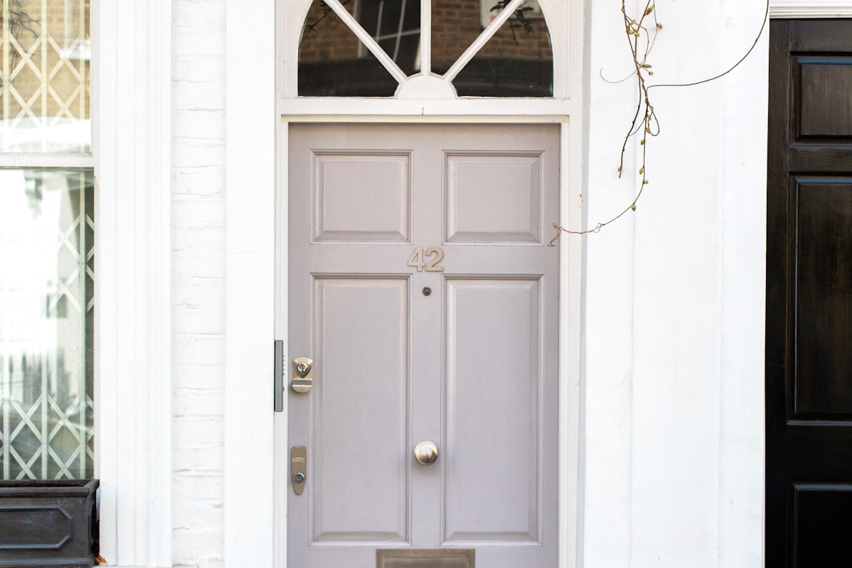 Classic paneled entry door with a fanlight